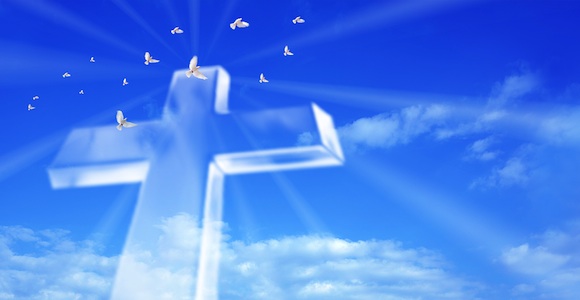 beaming cross in blue sky